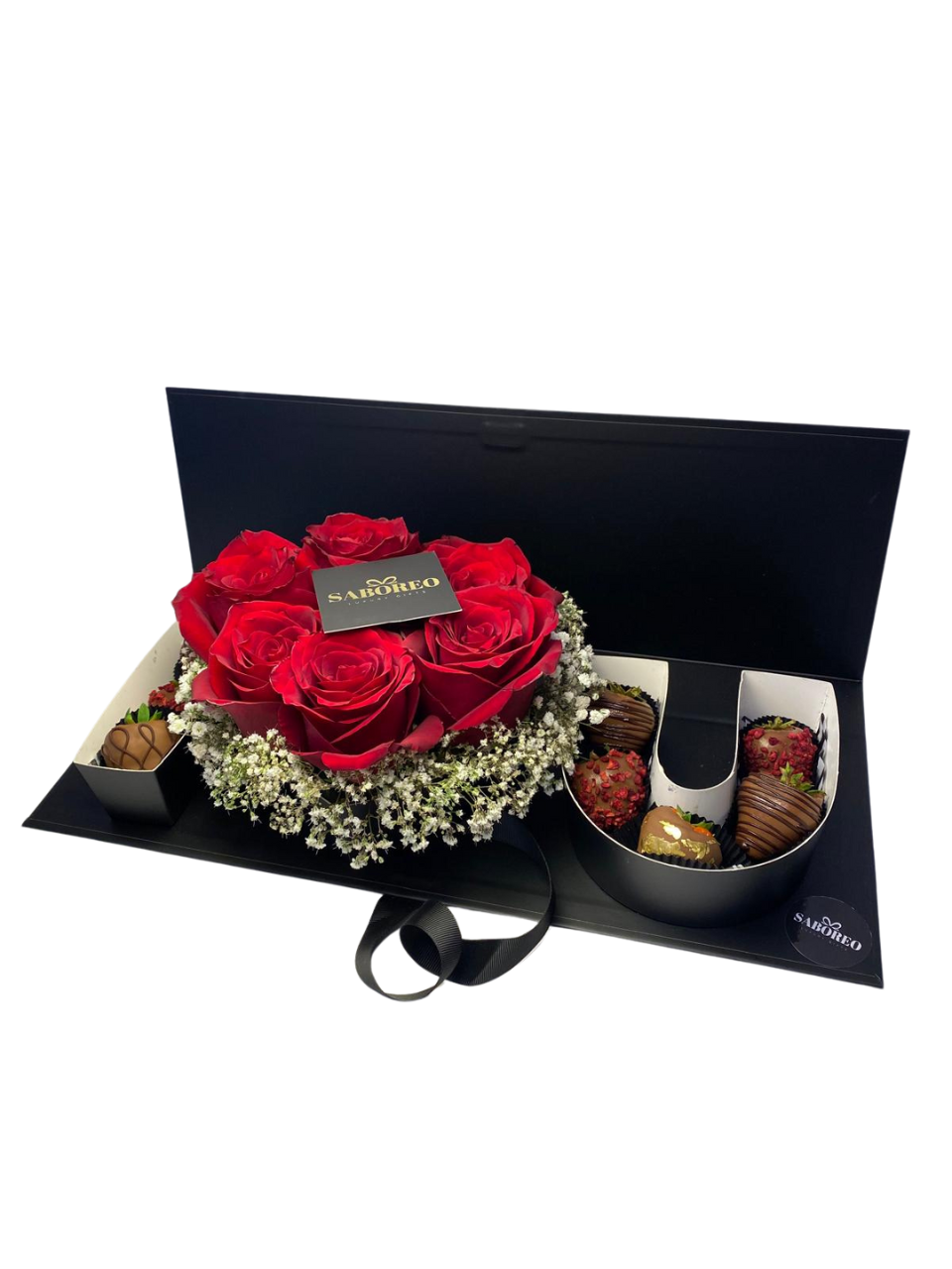 Gourmet chocolate set with red roses in a black box on a white background. luxury chocolate-covered strawberries with gold leaf Zürich