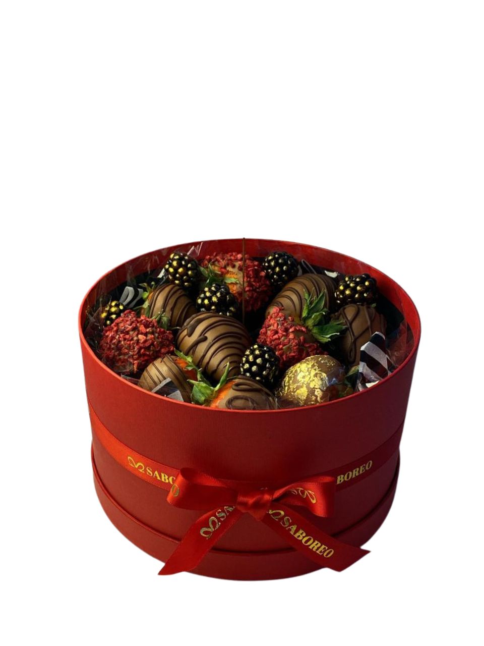 Red gift box filled with assorted chocolates on a white background luxury chocolate-covered strawberries with gold leaf Zürich